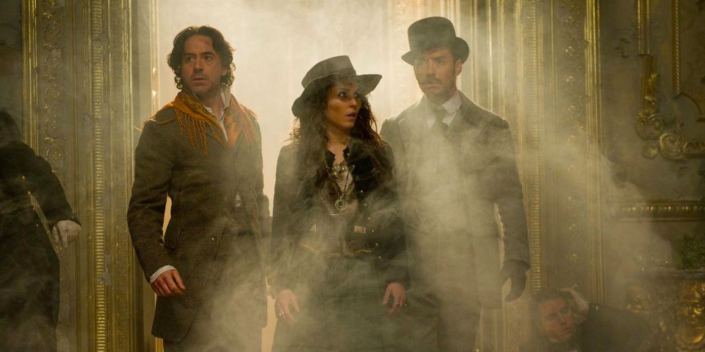 Holmes, Madame Simza, and Watson entering a smoky room in Sherlock Holmes: A Game of Shadows