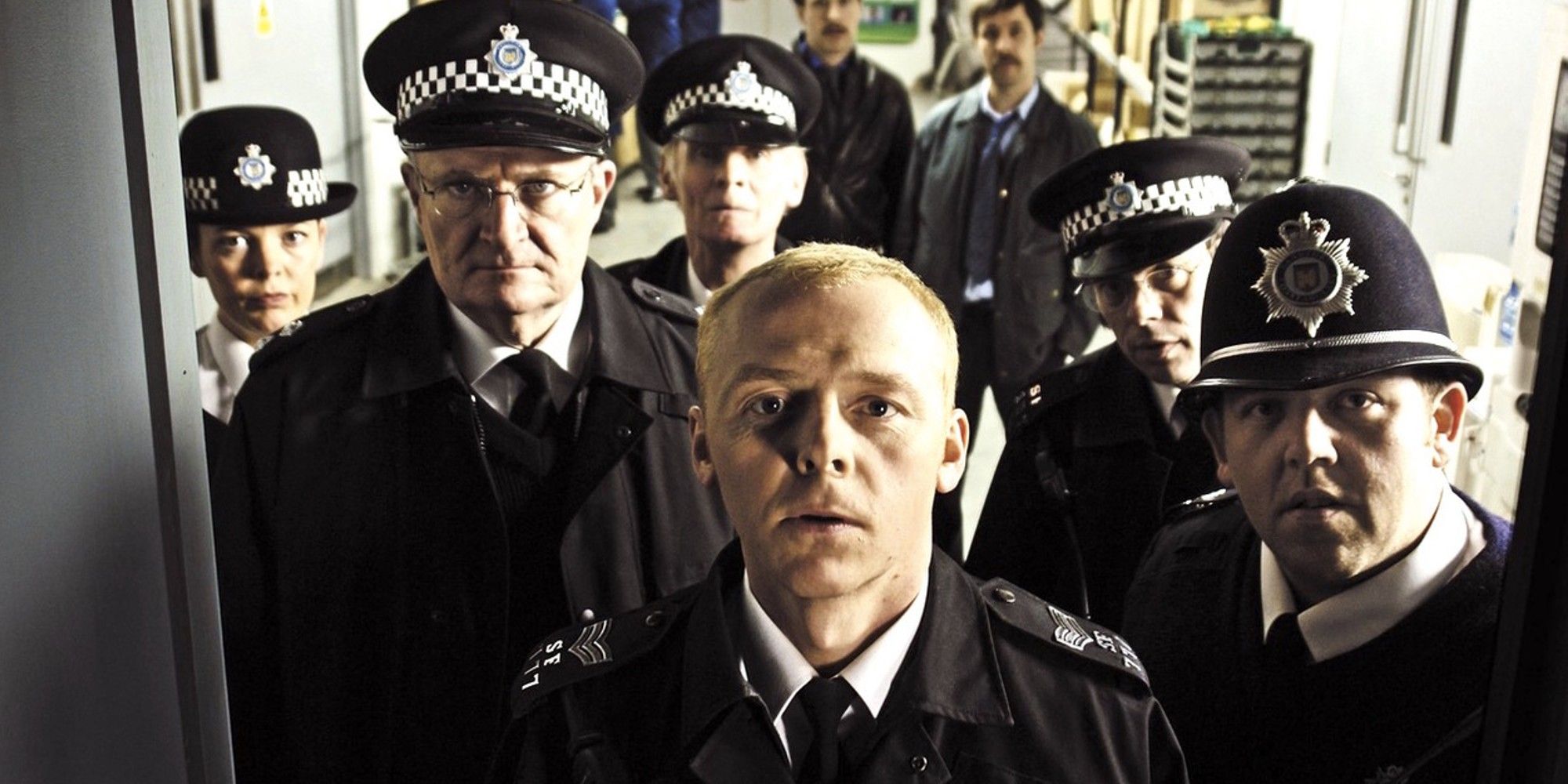 Simon Pegg as Nicholas Angel, Nick Frost as Danny Butterman, Jim Broadbent as Frank Butterman and Olivia Colman as Doris Thatcher in Hot Fuzz