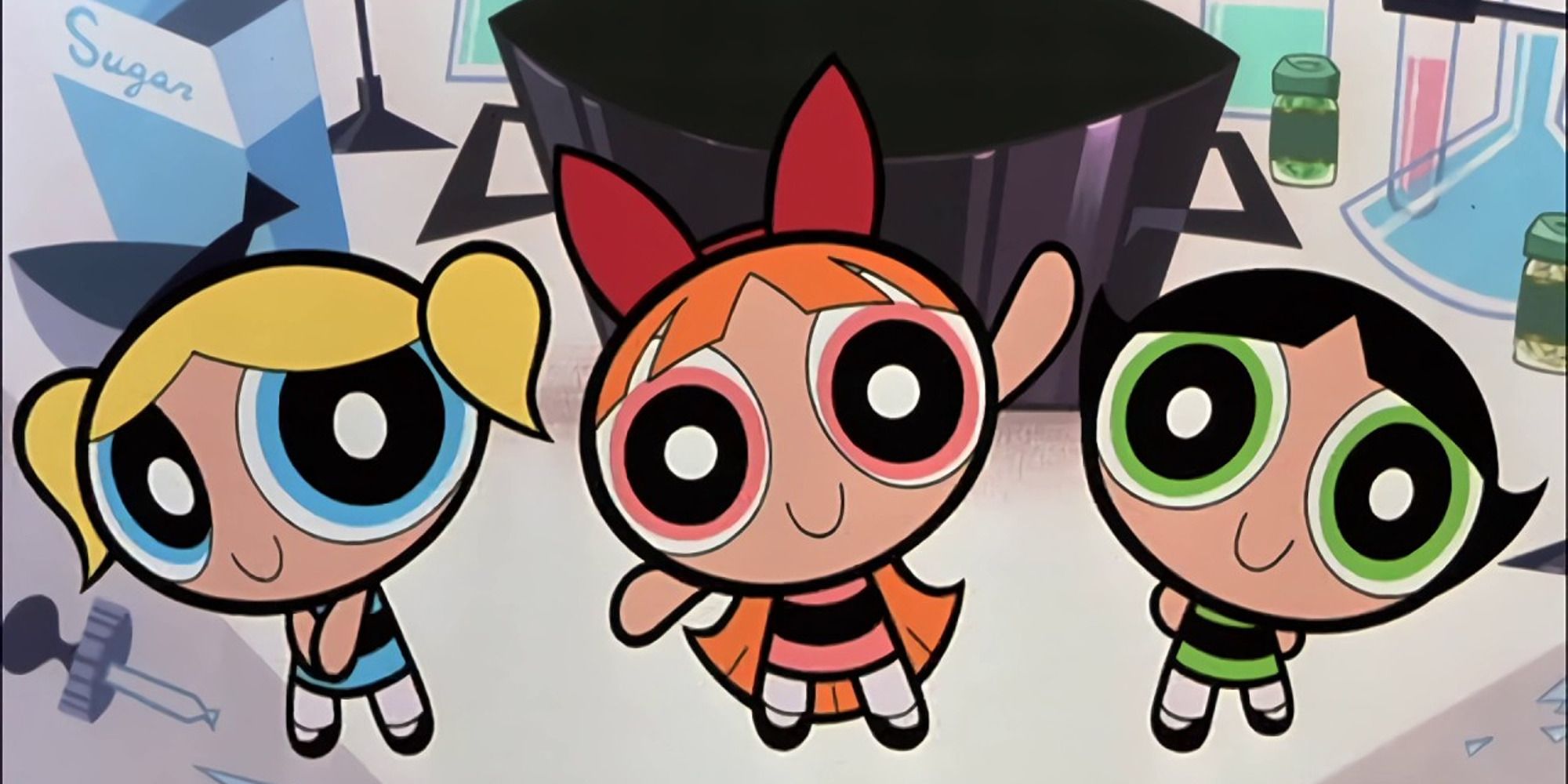 Powerpuff Girls, Bubbles, Blossom and Buttercup on the table. 