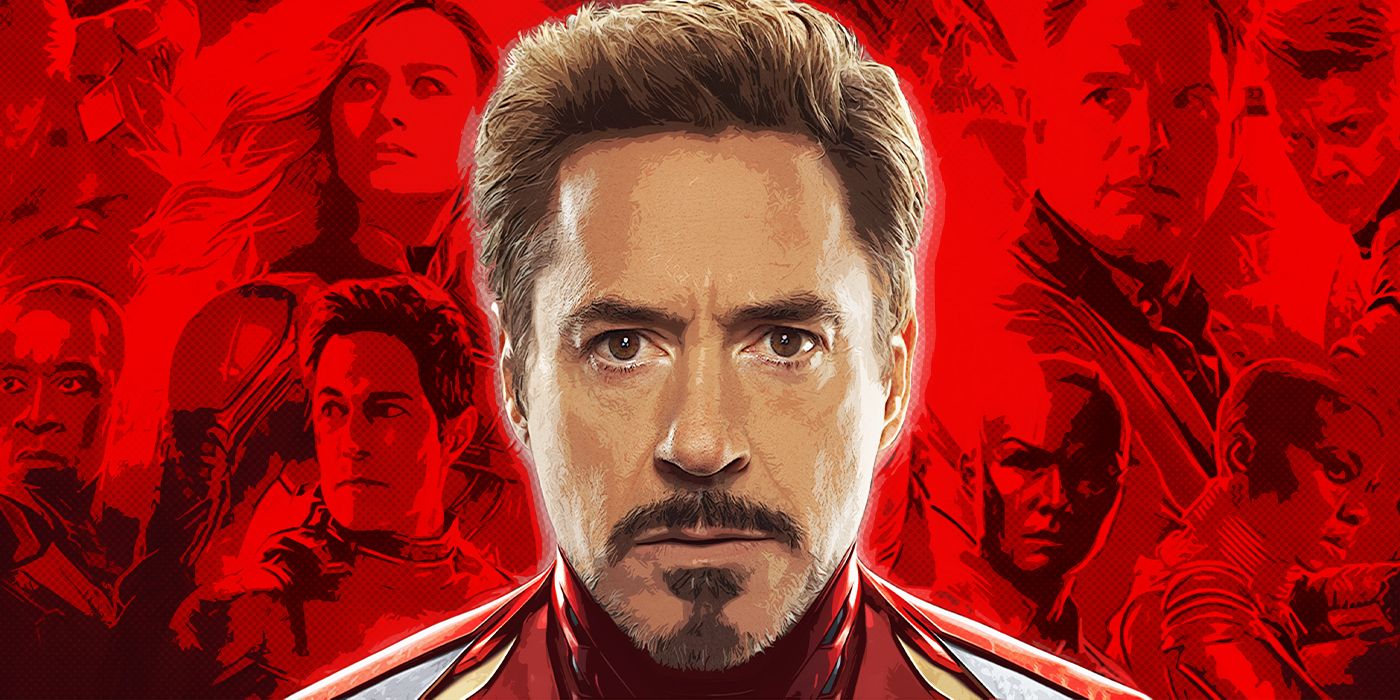 Robert Downey Jr as Tony Stark standing in front of images of MCU cast