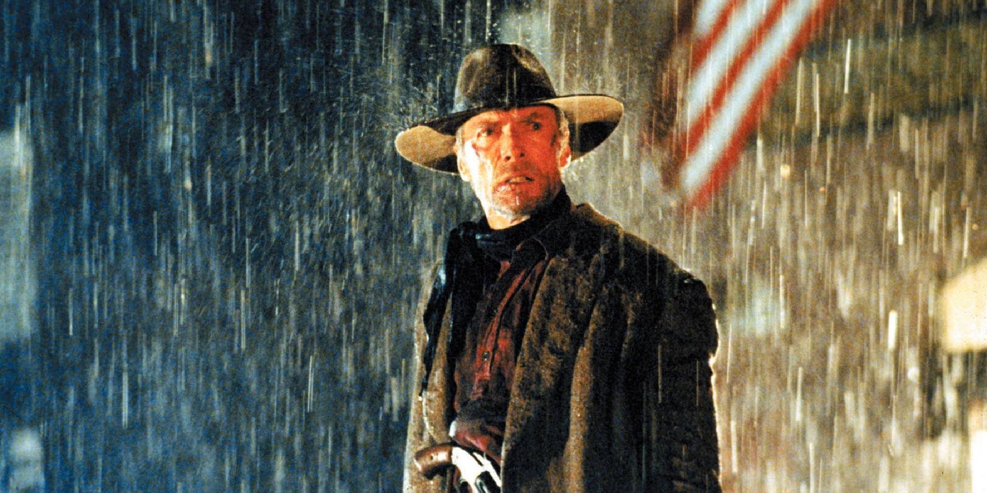 Clint Eastwood as William Munny, standing in the rain, in Unforgiven