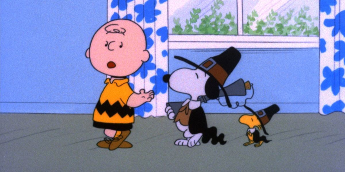 Snoopy and Woodstock disguised as Pilgrims following Charlie Brown in A Charlie Brown Thanksgiving