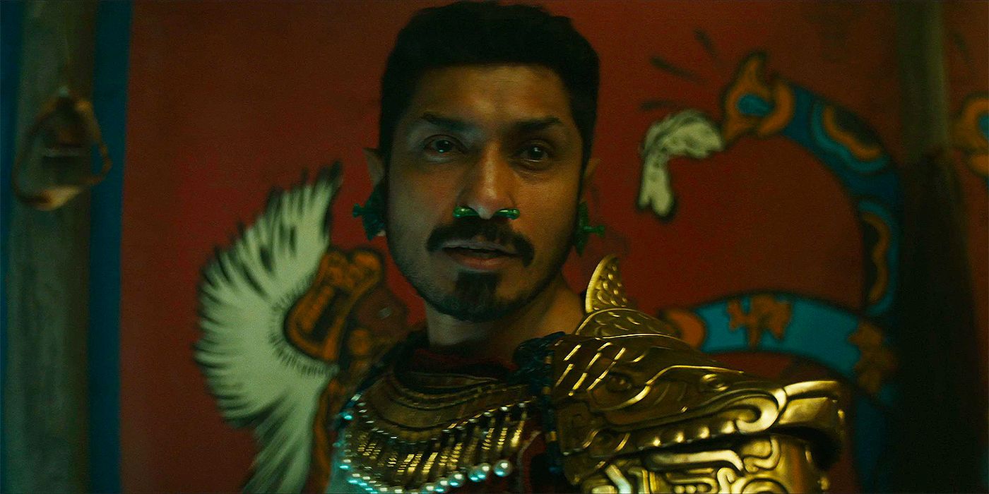 Tenoch Huerta Mejía as Namor in Talokan in front of the mural in Black Panther: Wakanda Forever