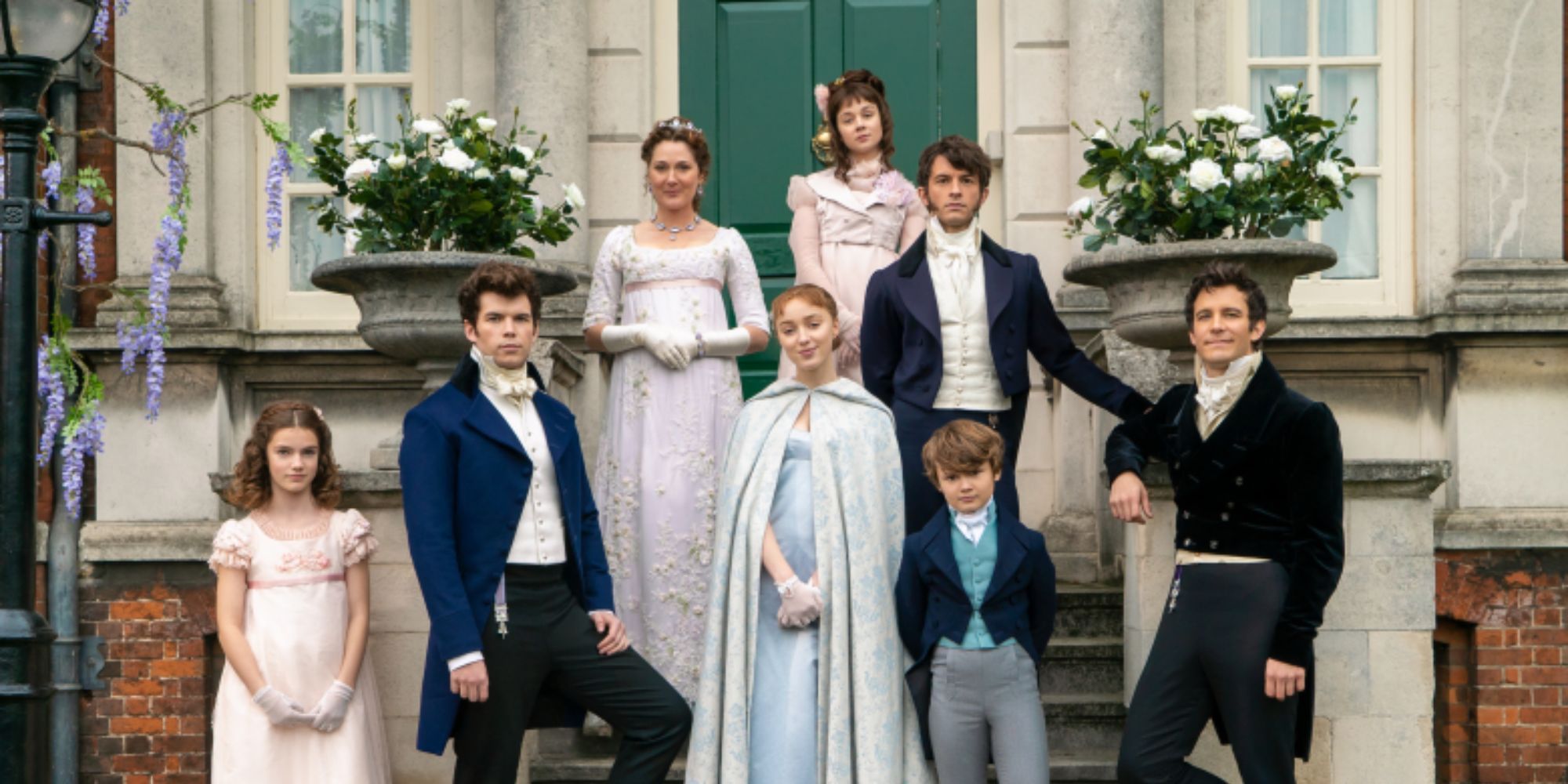 The Bridgerton family posing for a photo outside their home.