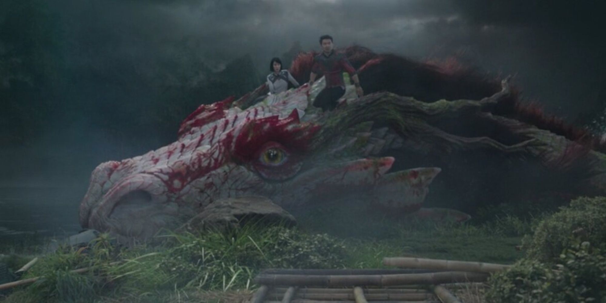 Shang-Chi and Xialing riding the Great Protector dragon in Ta-Lo in Shang-Chi and the Legend of the Ten Rings