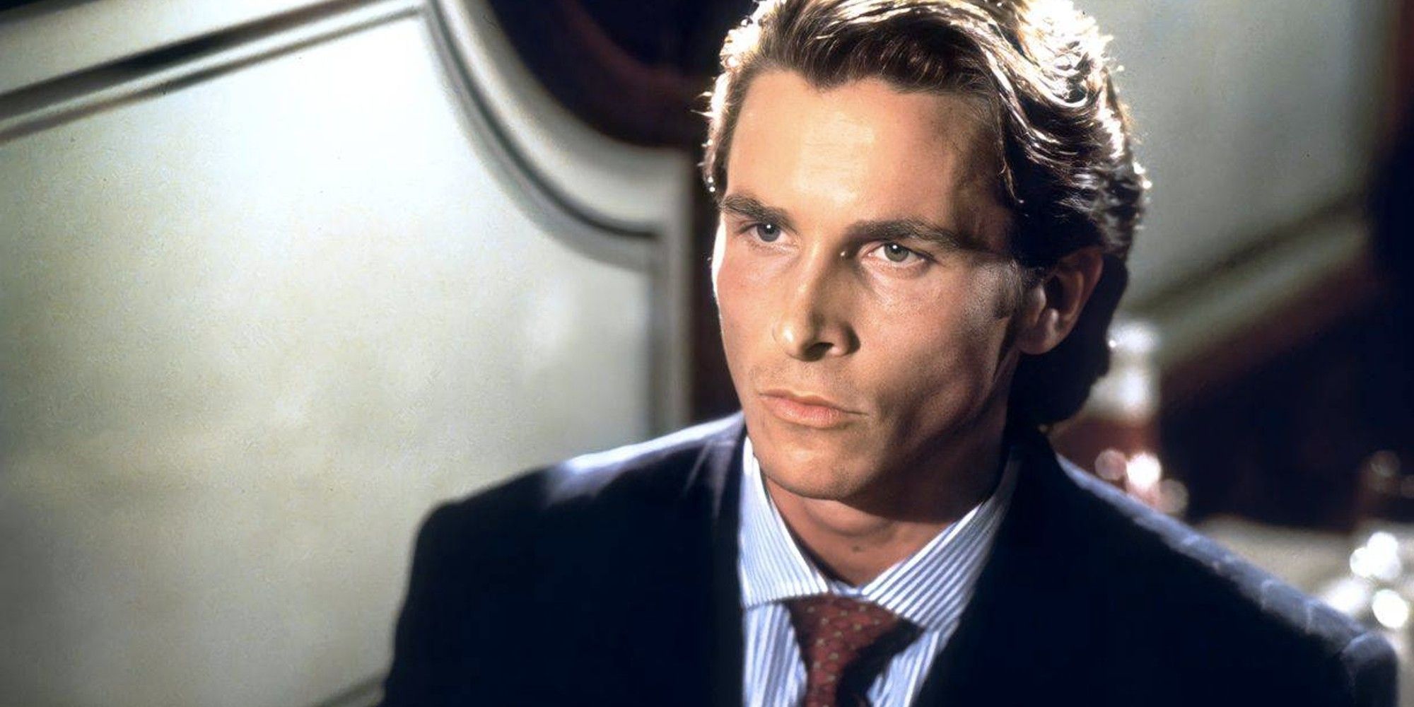 Christian Bale as Patrick Bateman looking straight ahead in American Psycho