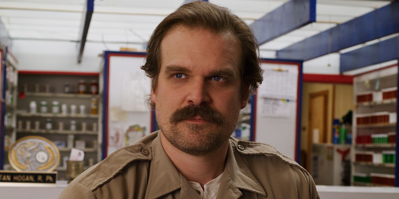 David Harbour as Sheriff Jim Hopper looking ahead stoically in Stranger Things
