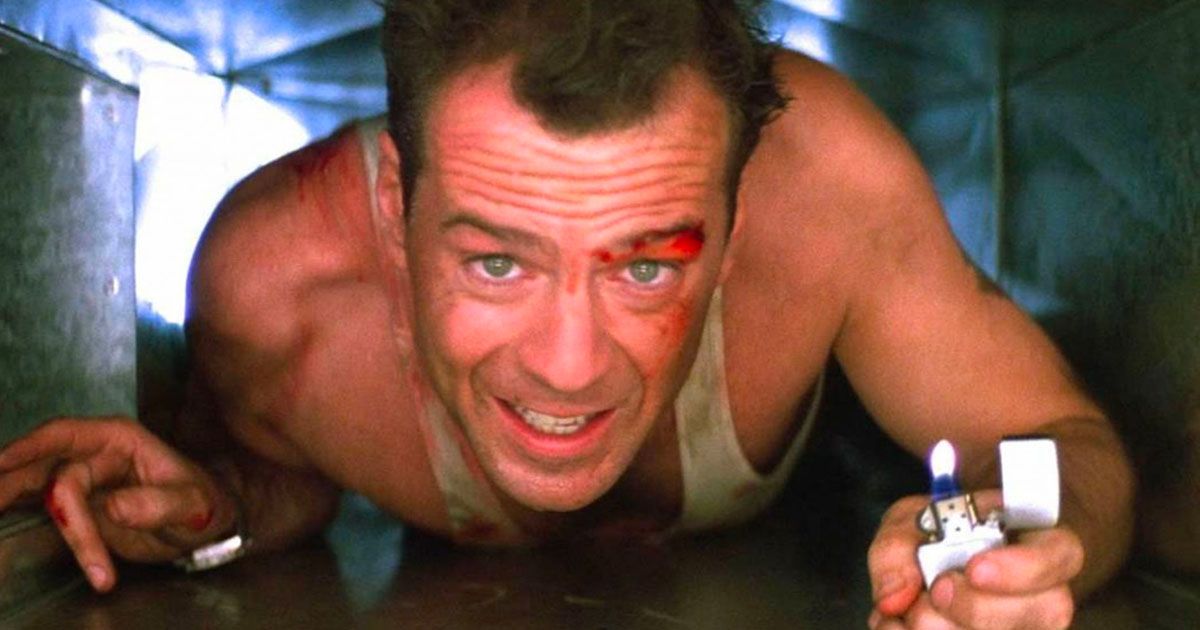 Bruce Willis as John McClane crawling out of a vent in Die Hard