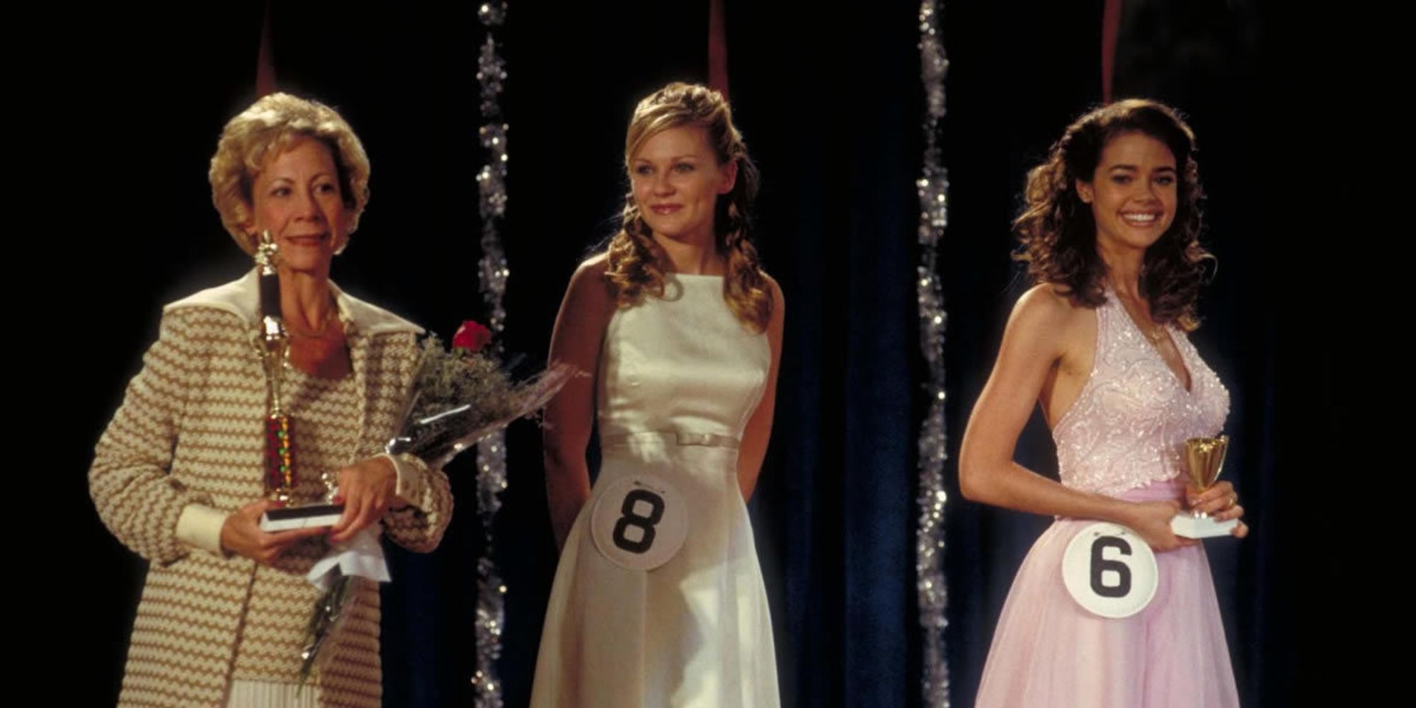 Kirsten Dunst and Denisse Richards on stage at a beauty pageant in Drop Dead Gorgeous