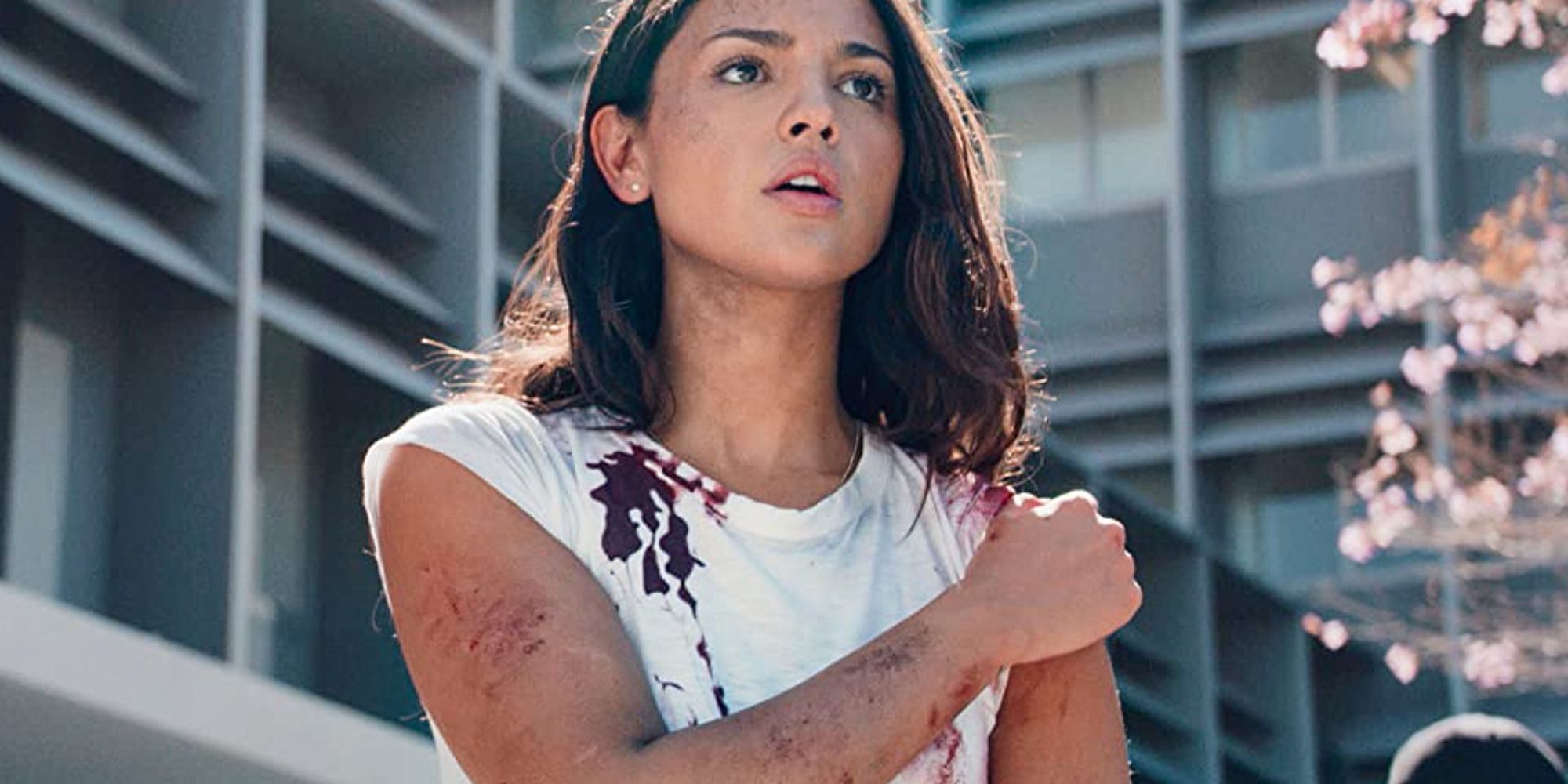 woman with white shirt covered in blood