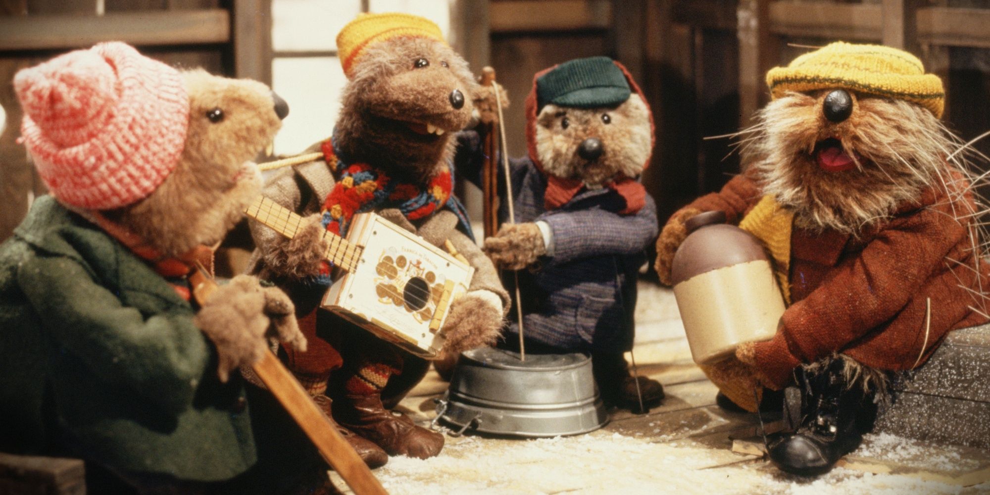 A group of puppet otters playing musical instruments