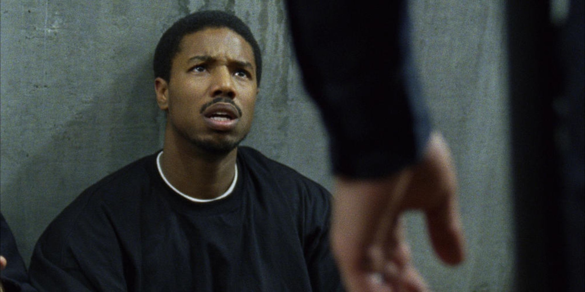 Fruitvale Station's Michael B. Jordan looking up at officer