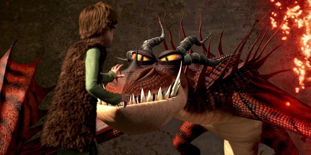 Hiccup standing before a Monsterous Nigthmare
