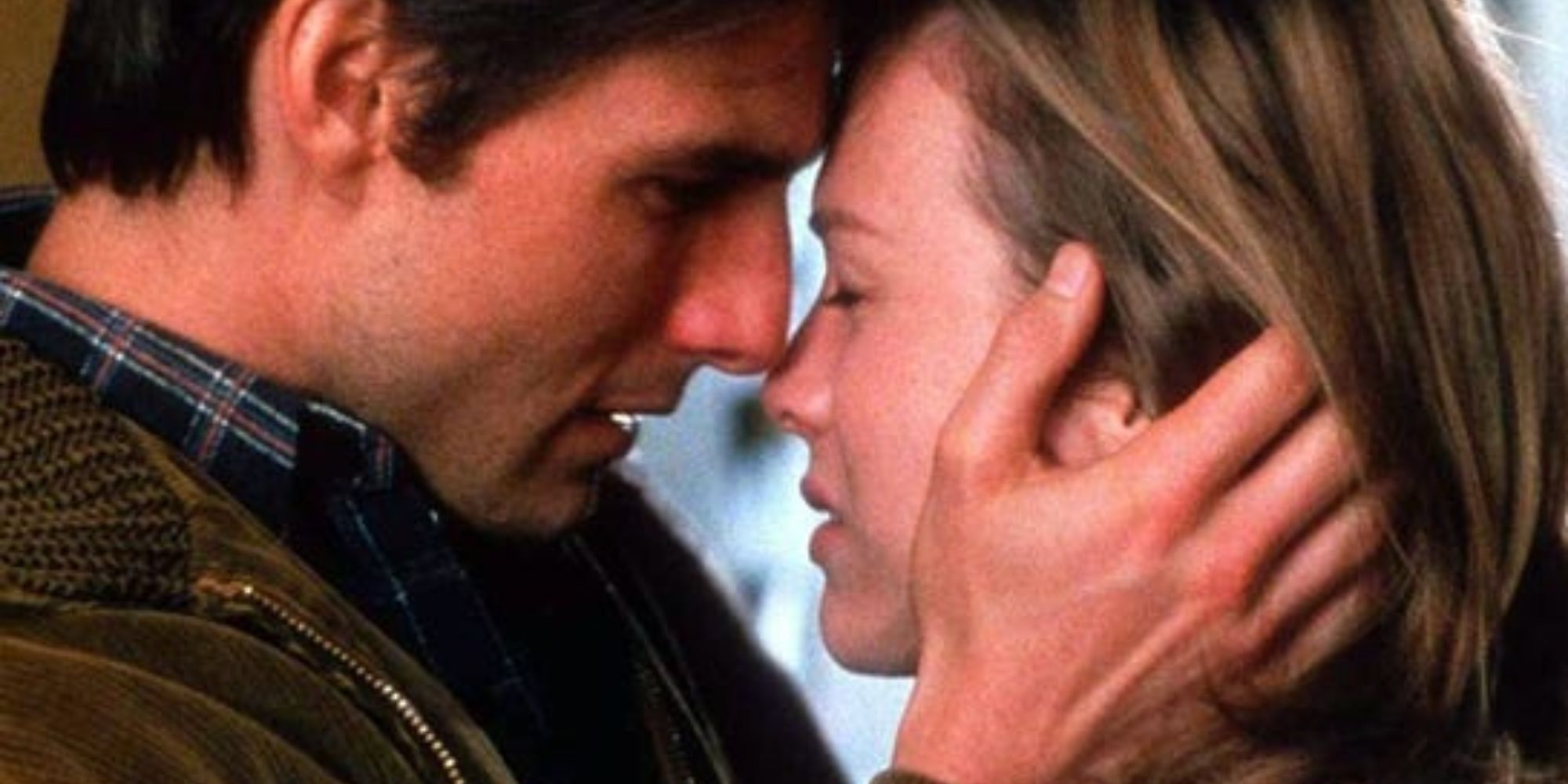 Tom Cruise and Reneé Zellweger about to kiss in Jerry Maguire