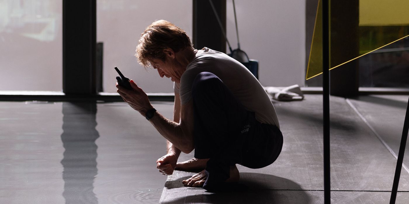 Nemo crouching on the floor while holding a radio in Inside