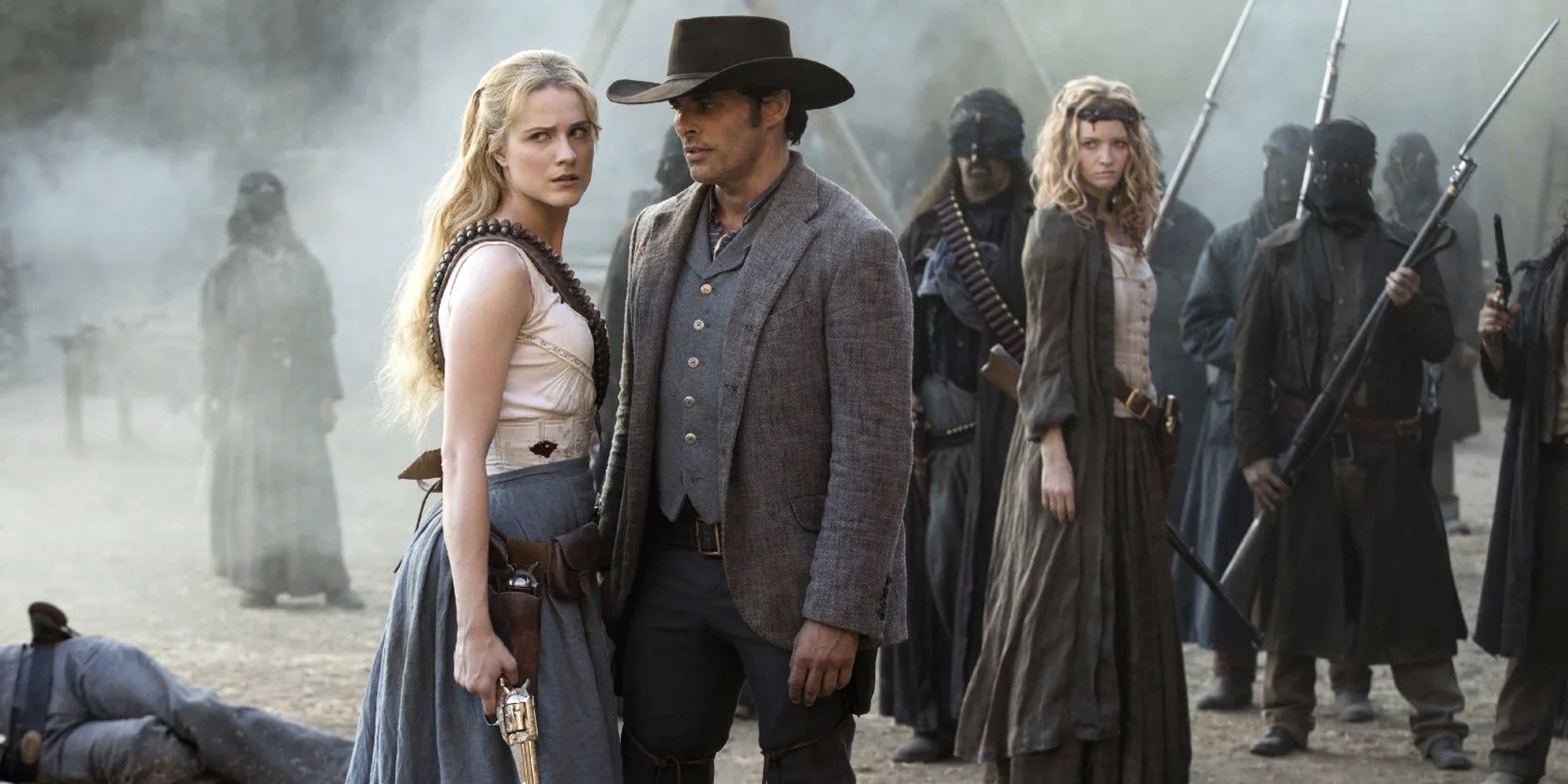 Dolores and Teddy Flood standing among a crowd in Westworld.