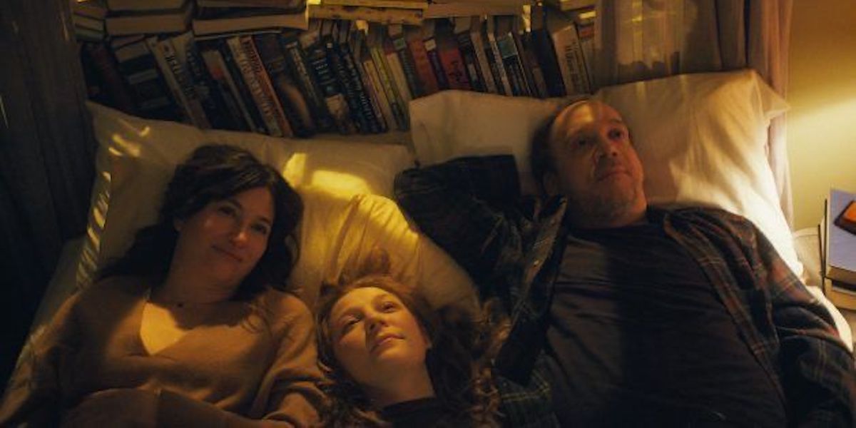 Kathryn Hahn as Rachel, Kayli Carter as Sadie, Paul Giamatti as Richard are lying in bed in Netflix's personal life