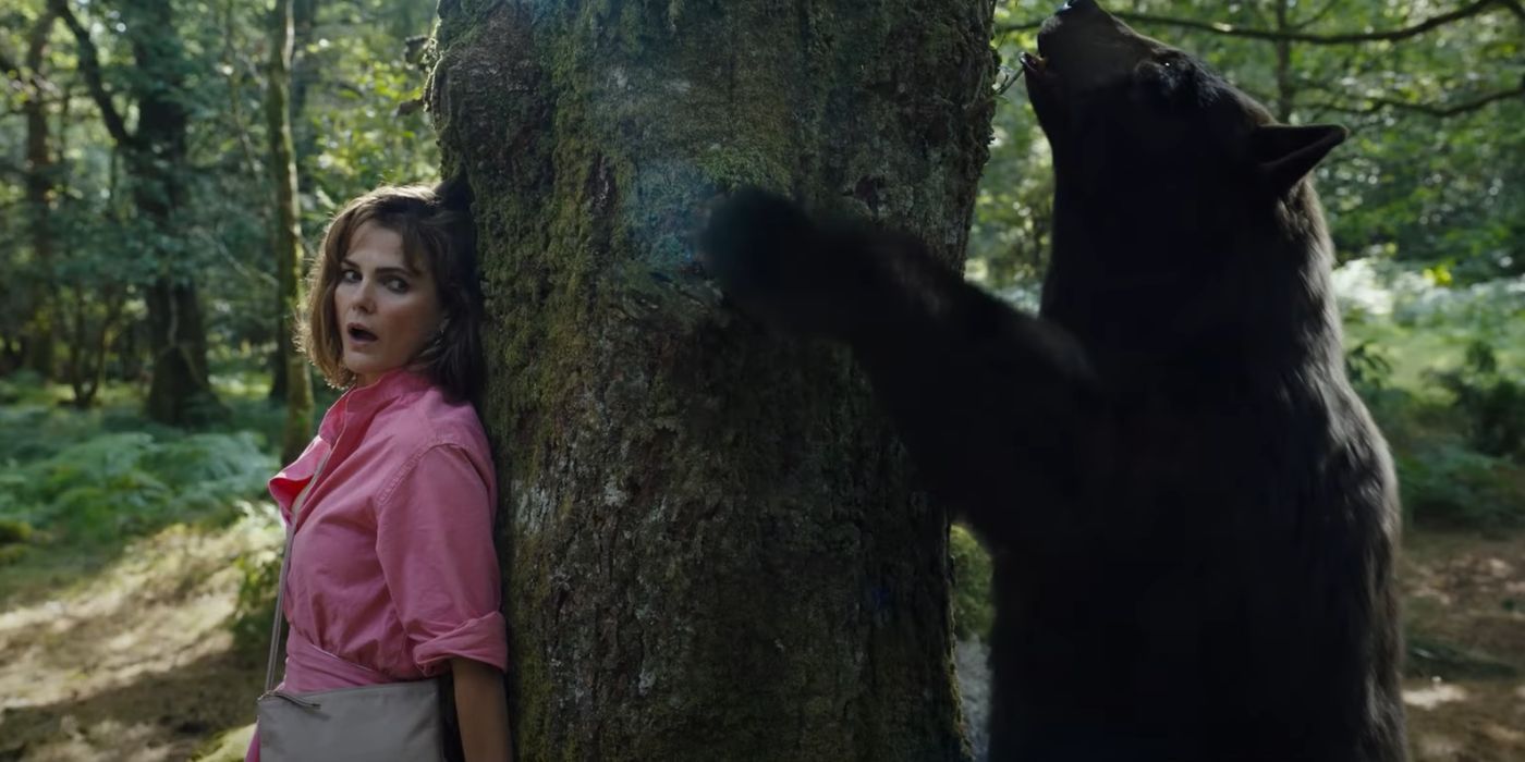 Keri Russell hiding from the Cocaine Bear in Elizabeth Banks' Cocaine Bear