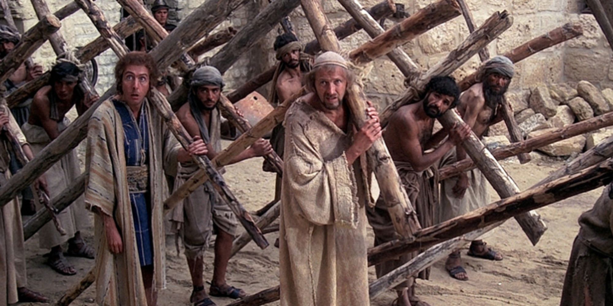 Brian and other crucifixion victims carry their crosses in Monty Pyton's Life of Brian 