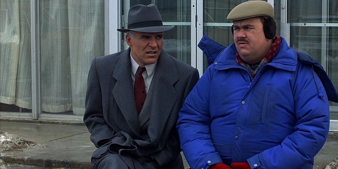 Neal Page (Steve Martin) and Del Griffith (John Candy) sit next to each other on a freezing cold morning in 'Planes, Trains, & Automobiles'