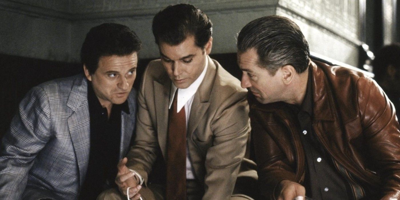 Tommy DeVito, Henry Hill, and James Conway huddled and talking to each other in Ray Liotta, Joe Pesci and Robert De Niro in Goodfellas.