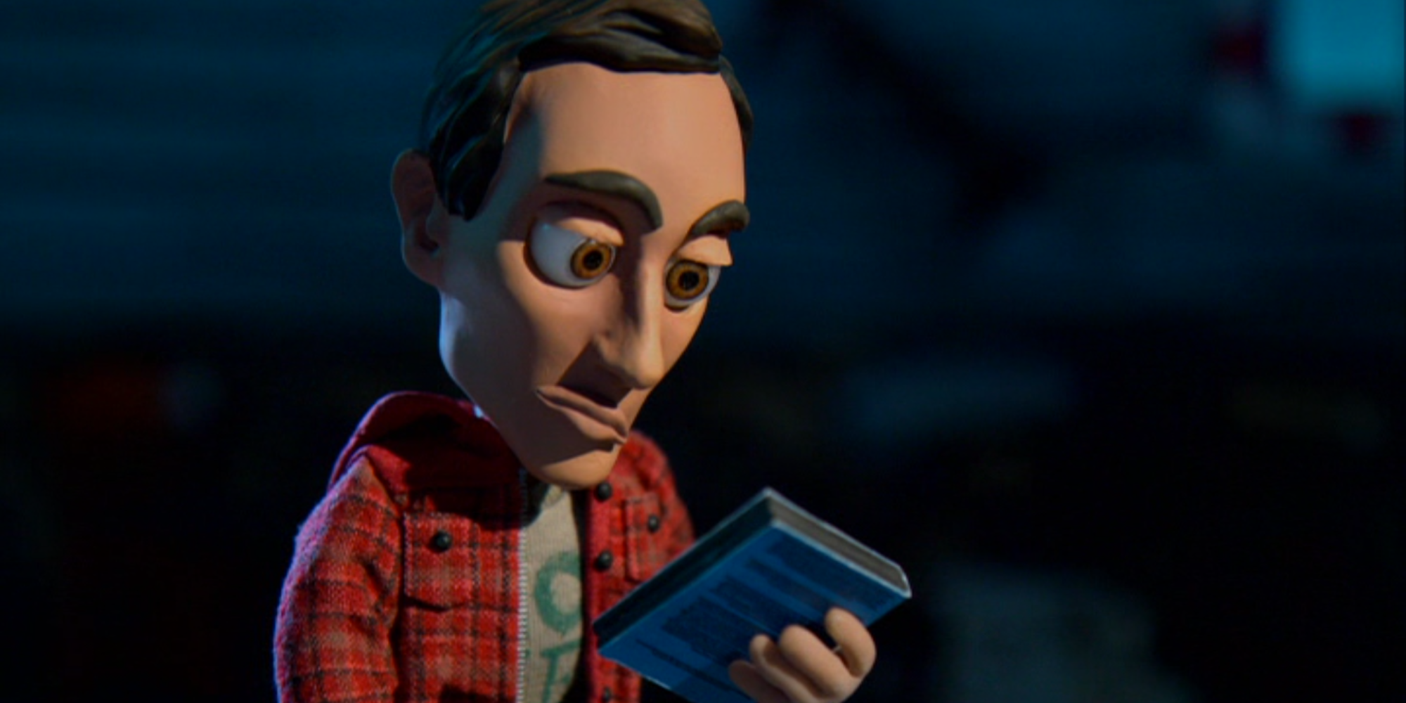 An claymation Abed in Community looking at a CD in episode Abed&rsquo;s Uncontrollable Christmas.