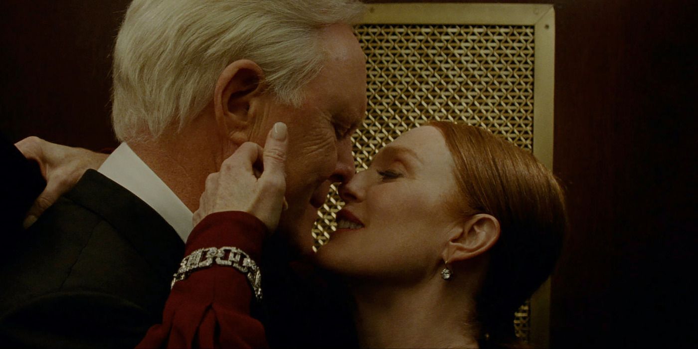 John Lithgow and Julianne Moore in a close-up embrace in Sharper