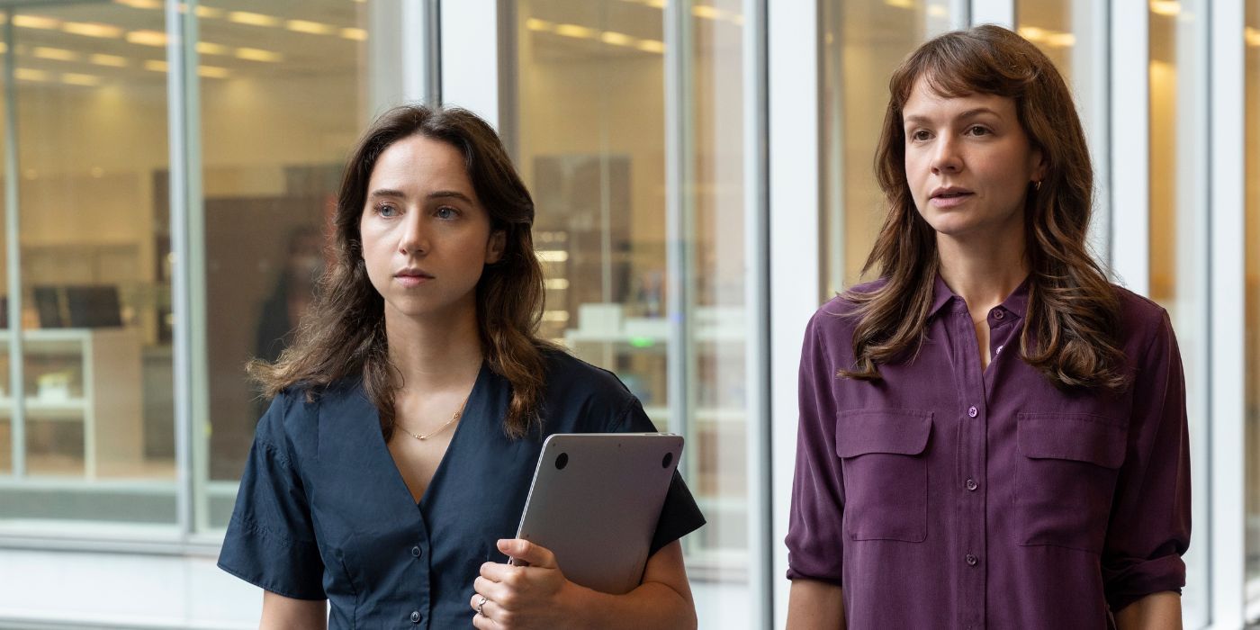 Two female reporters standing side by side and looking in the same direction in She Said.