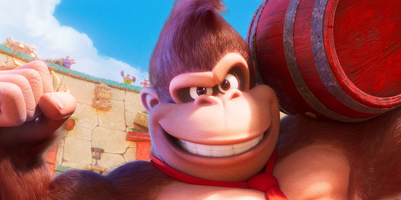 Donkey Kong smiling while carrying a barrel in The Super Mario Bros. Movie.