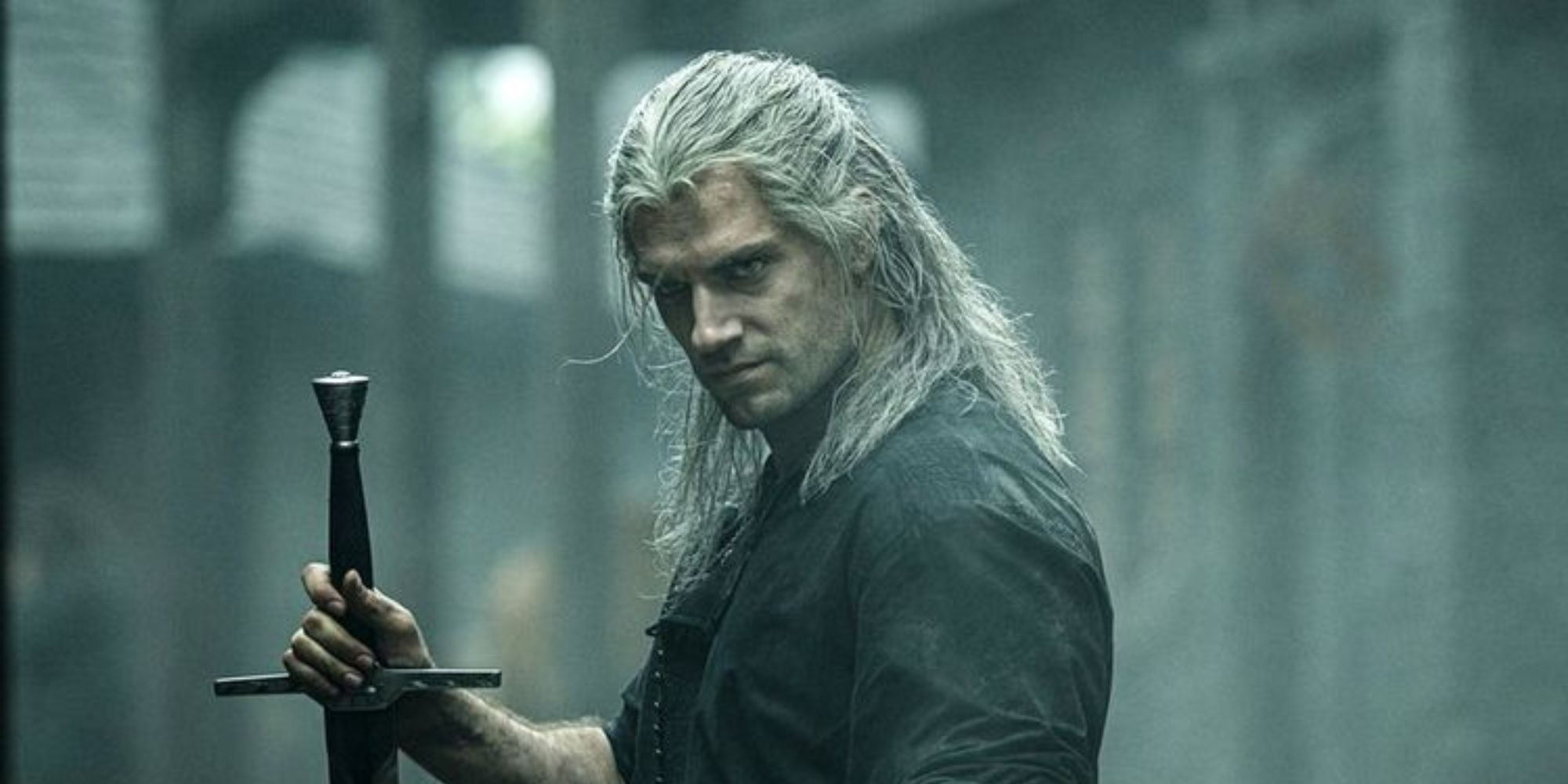 Geralt of Rivia holds his sword and looks something off camera at the Witcher