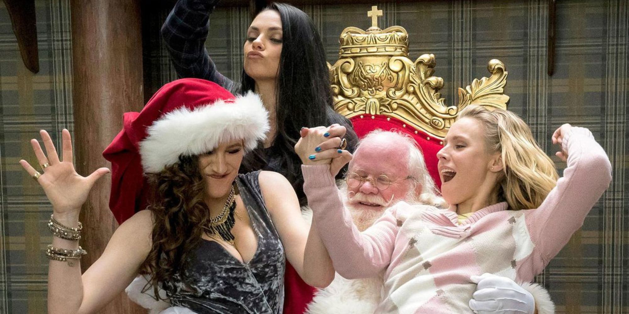 Three moms dancing on top of Santa