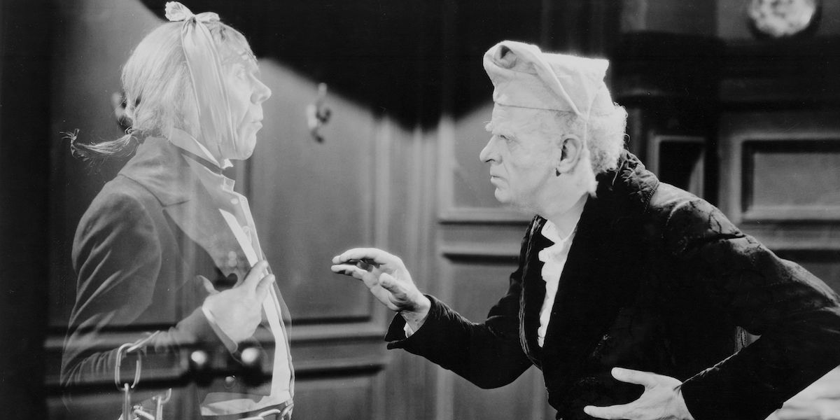 Reginald Owen as Ebenezer Scrooge talking to Leo G. Carroll as Marley's Ghost in A Christmas Carol (1938)