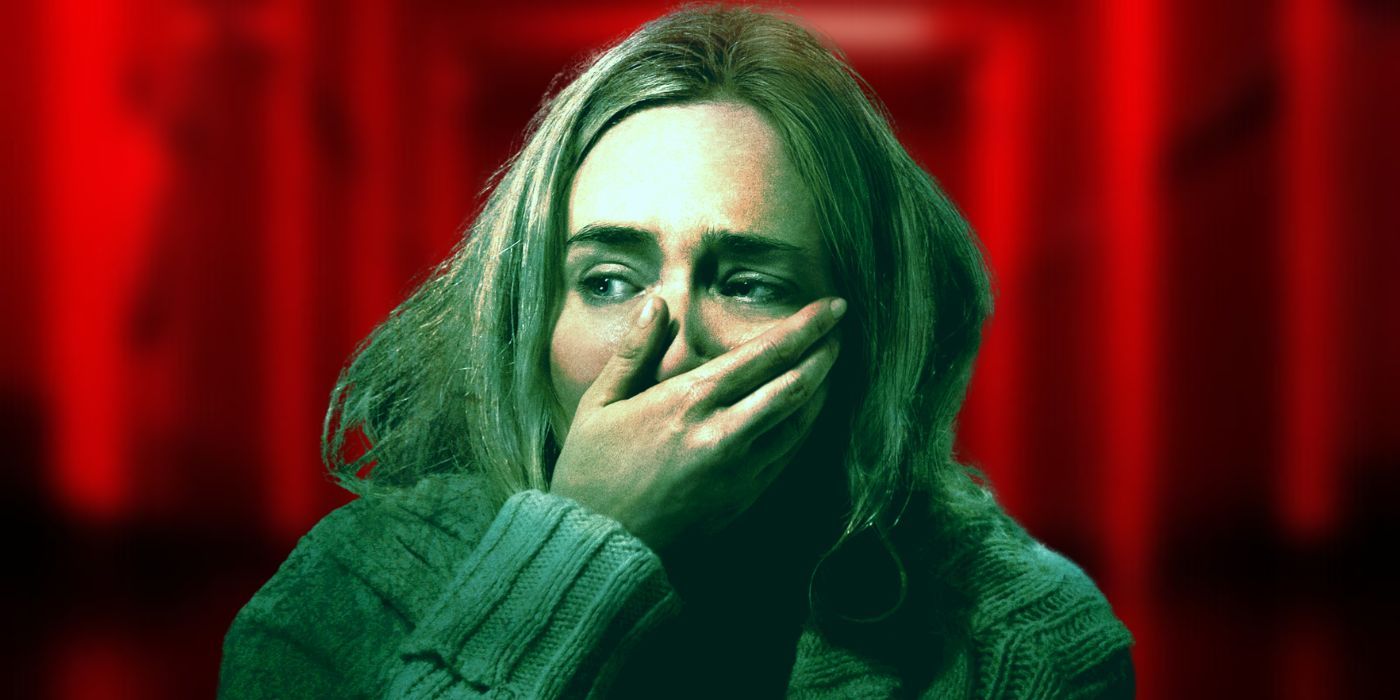 Emily Blunt as Evelyn Abbott from A Quiet Place covering her mouth, against a red background