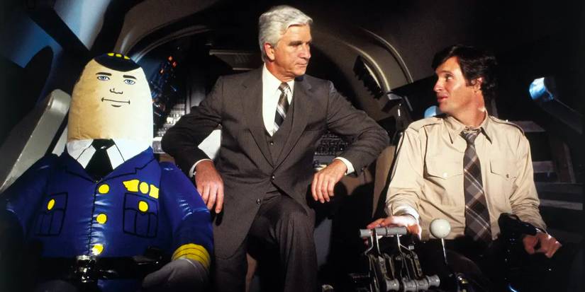 A pilot, a doctor, and an inflatable toy in the cockpit of an airplane.
