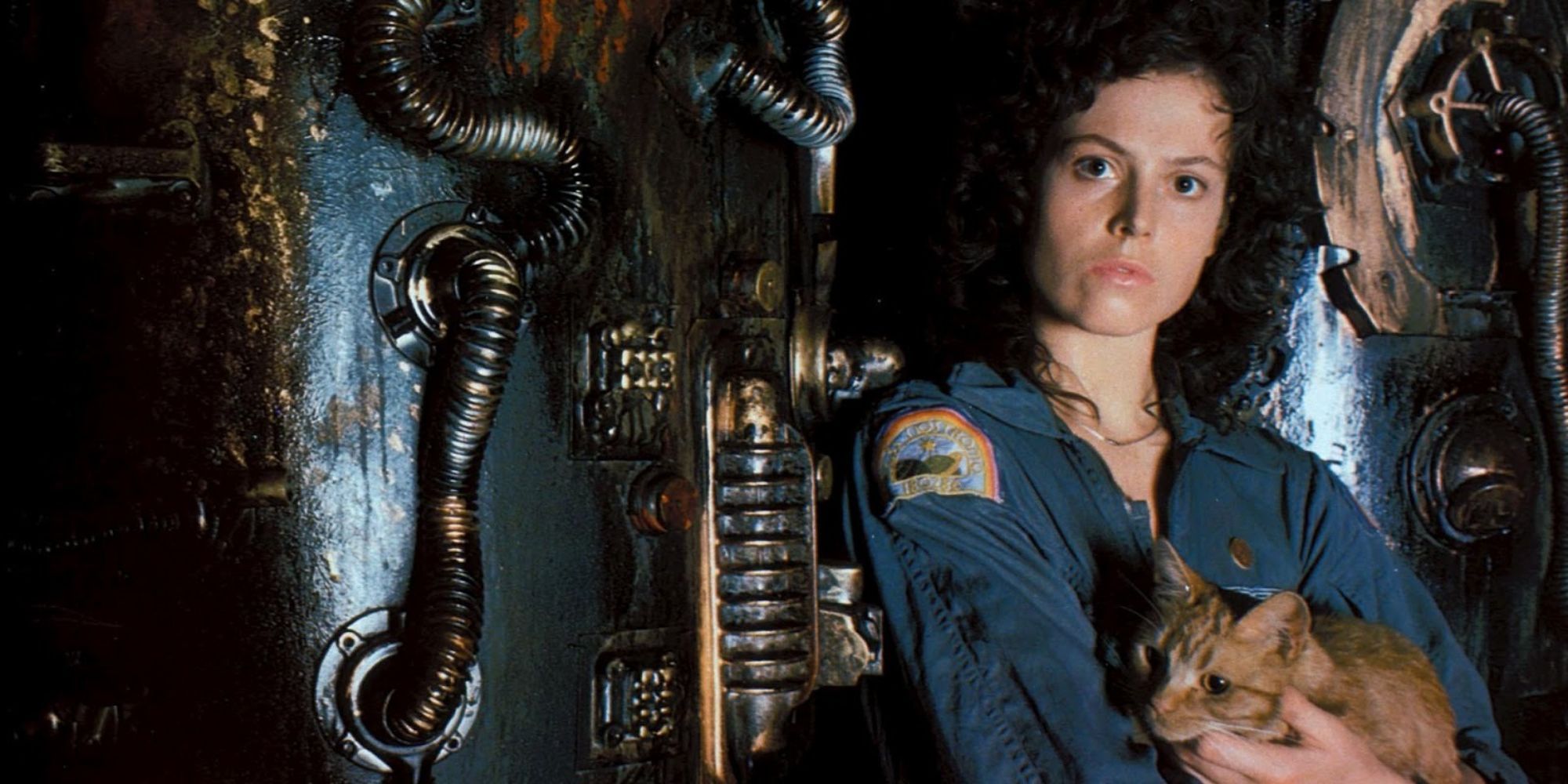 Ellen Ripley holding a cat and looking at the camera in 'Alien' (1979)