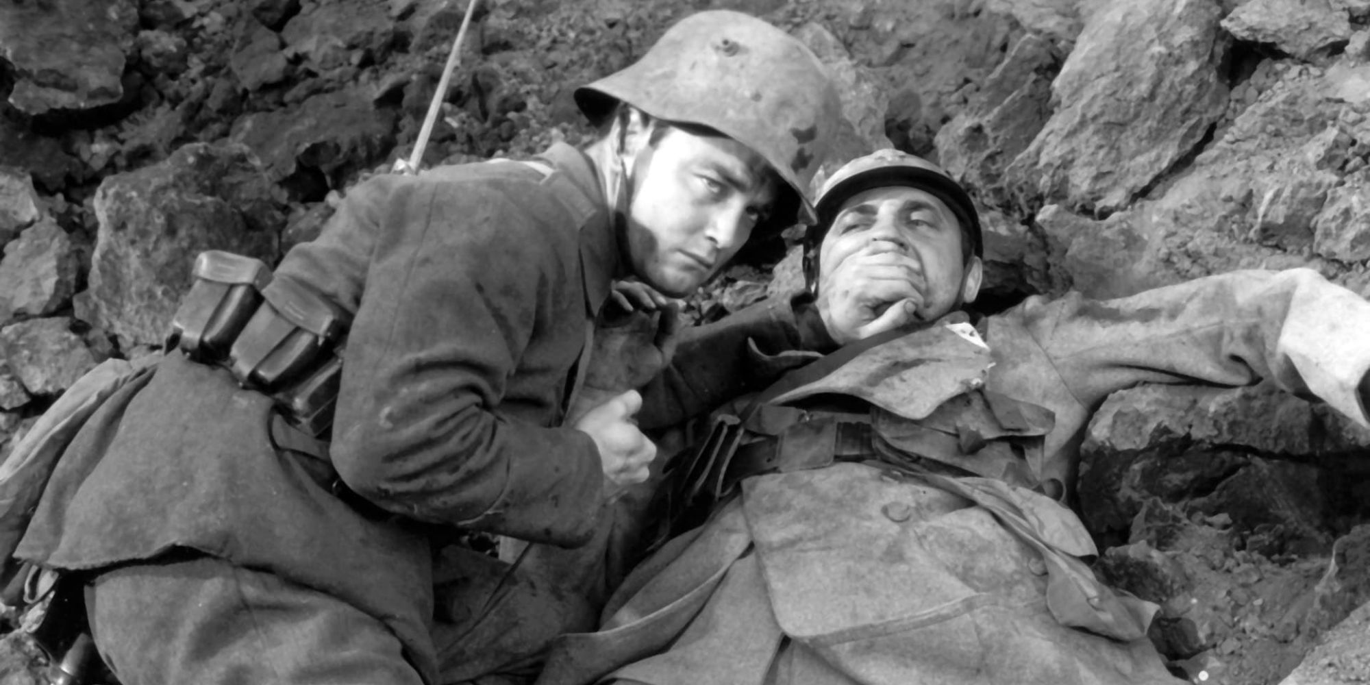 Paul claps his hand over the mouth of a dying French soldier