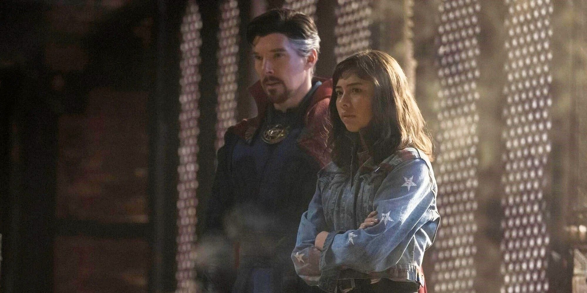 Benedict Cumberbatch and Xochitl Gomez as Doctor Strange and America Chavez looking seriously in the same direction in 'Doctor Strange in the Multiverse of Madness'