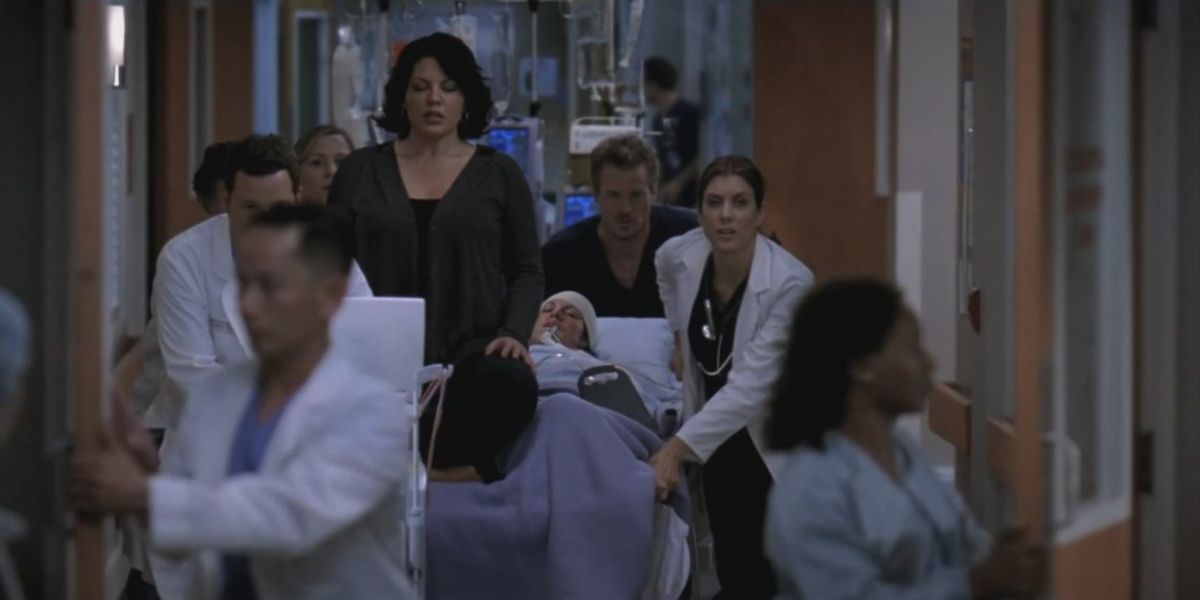 Callie, played by Sara Ramirez, and doctors in musical episode of Grey's Anatomy