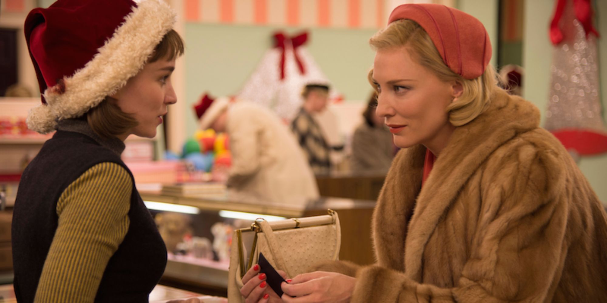 Cate Blanchett and Rooney Mara as Carol and Therese talking in a department store