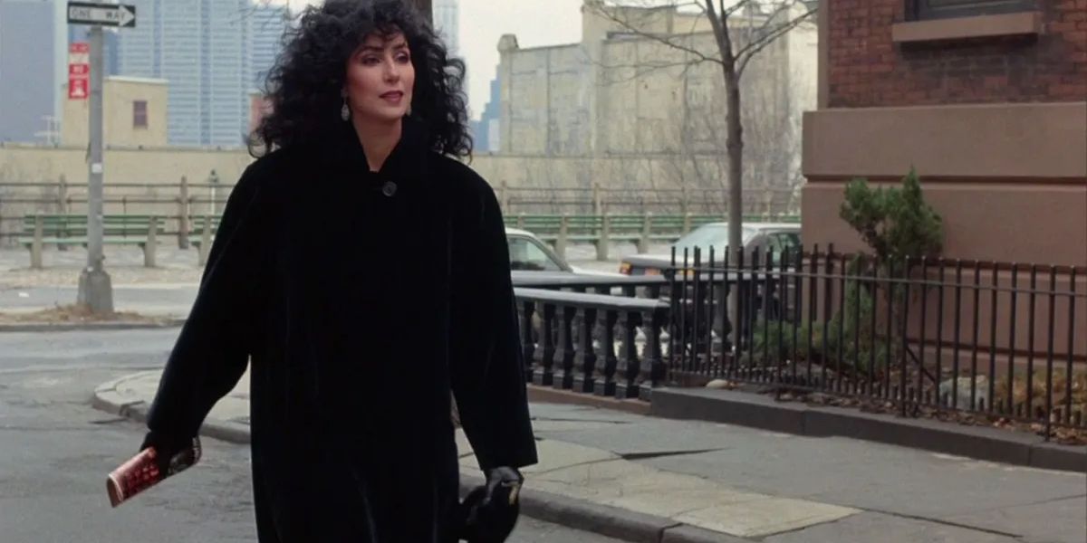 Cher as Loretta walking down the street in Moonstruck