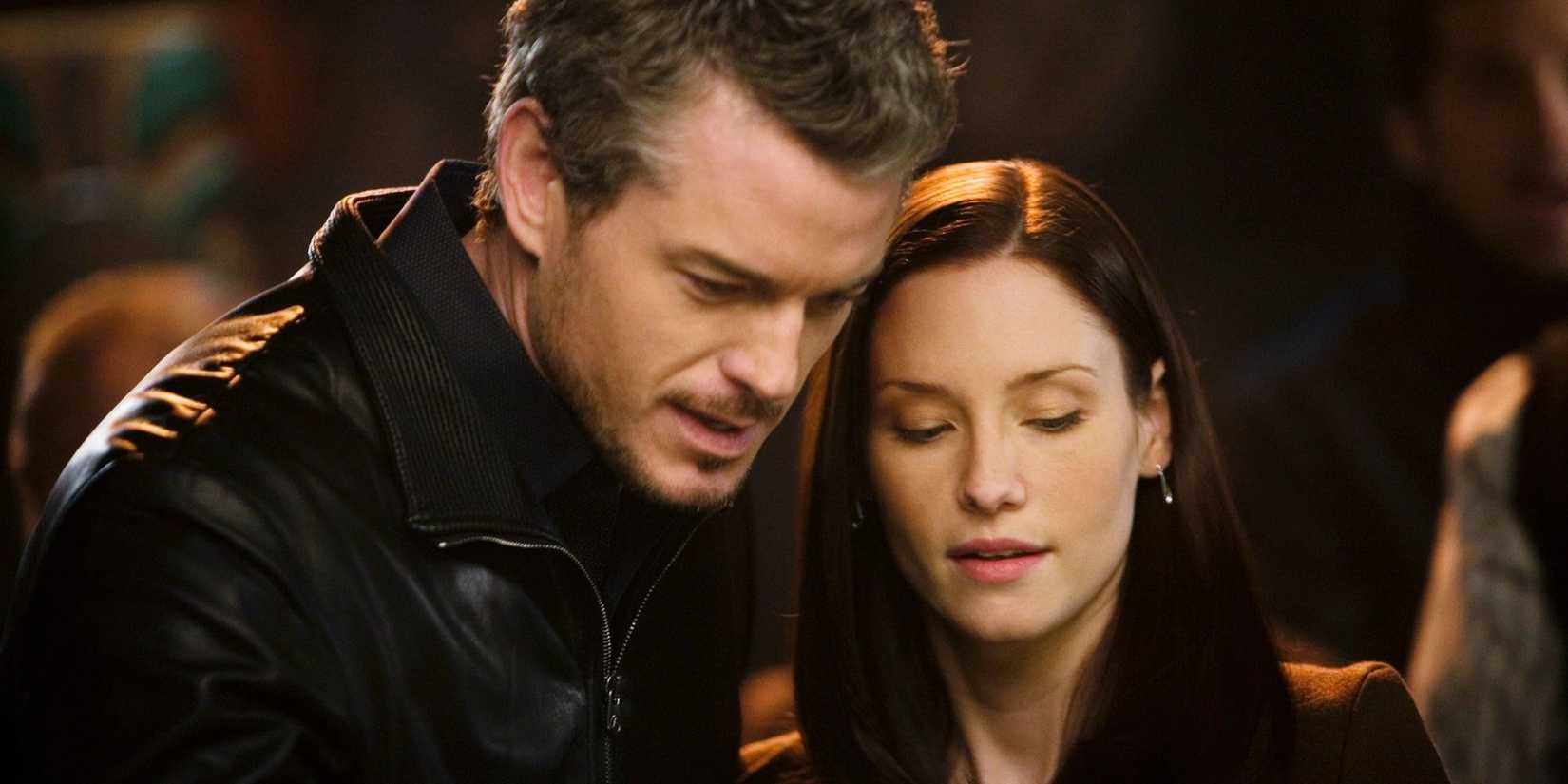 Eric Dane and Chyler Leigh as Mark Sloan and Lexie Grey with their heads leaning together in Grey's Anatomy.