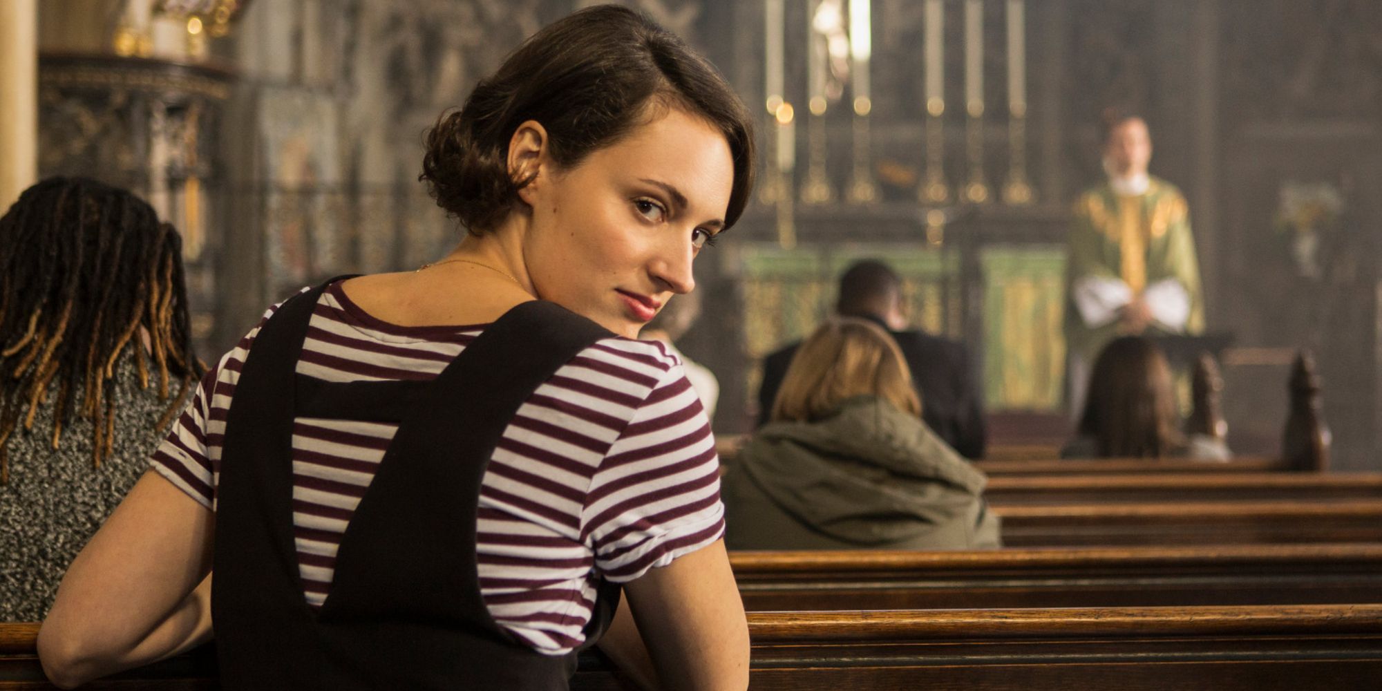 Fleabag at church turning around to talk to the camera in Fleabag.