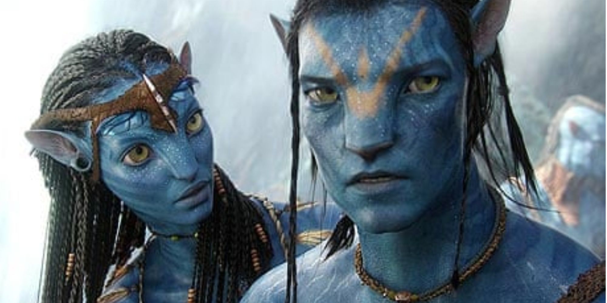 Zoe Saldaña as Neytiri talking to Sam Worthington as Jake Sully in Avatar