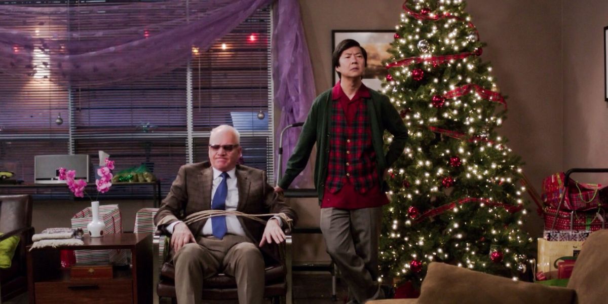 Ken Jeong has Malcom McDowell tied up in a chair next to a Christmas tree in the Intro to Knots episode of Community