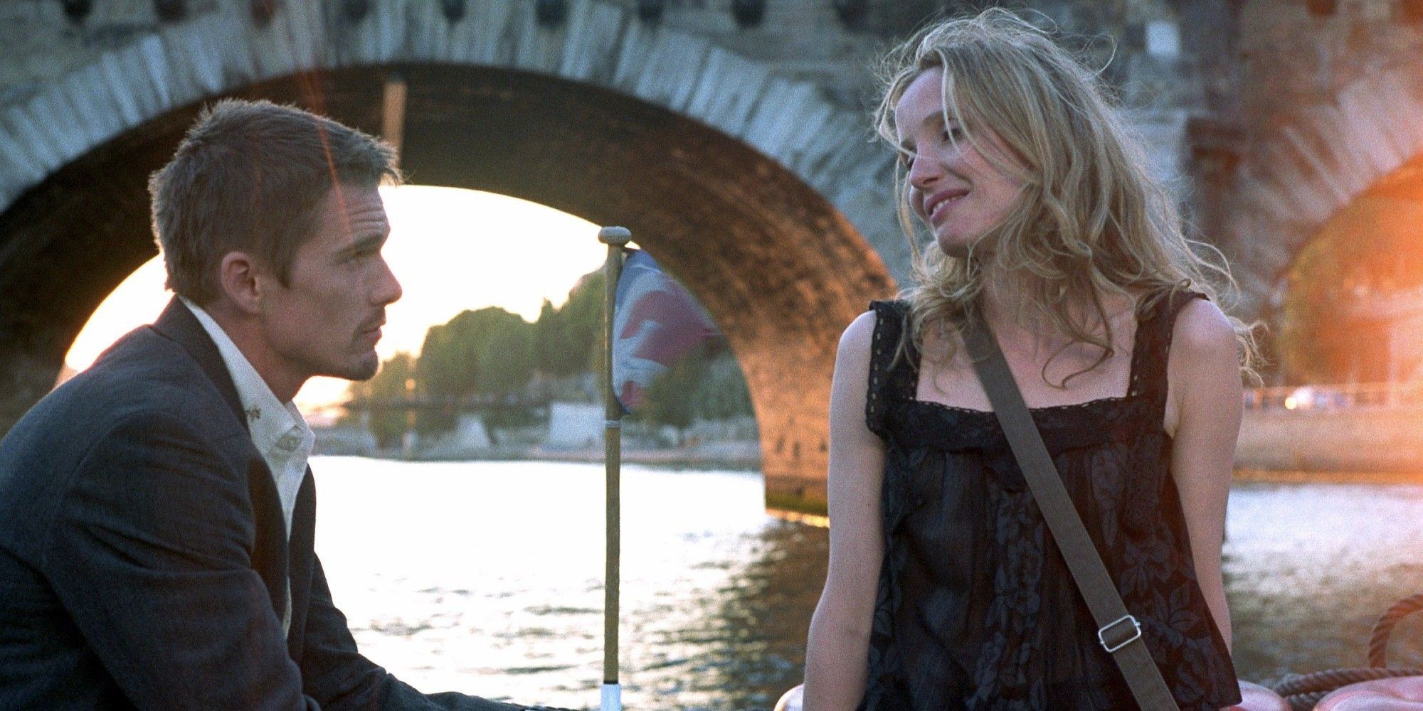 Ethan Hawke and Julie Delpy in 'Before Sunset' looking at each other as Jesse and Celine.