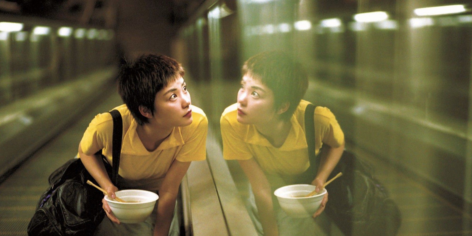 Faye Wong as Faye looking through a mirrored wall in 'Chungking Express.'