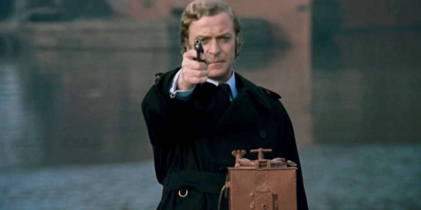 Michael Caine as Jack Carter pointing a gun in Get Carter