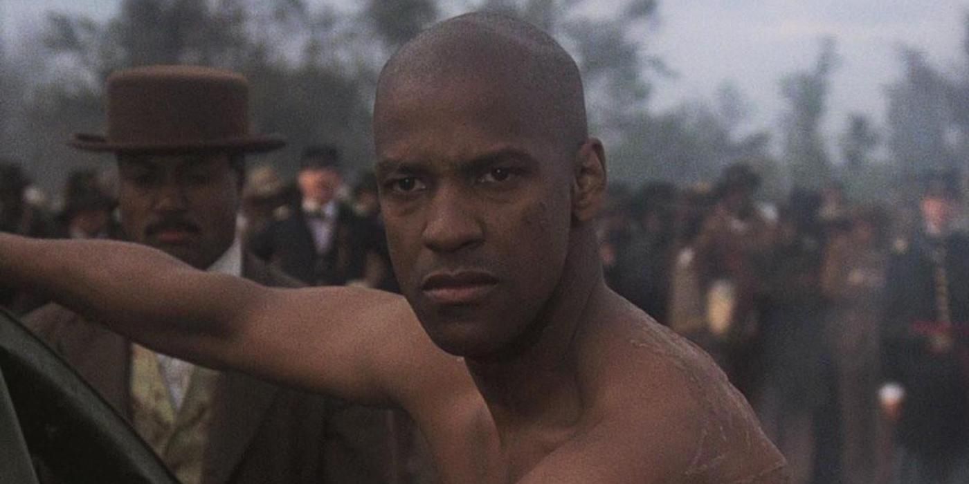 Shirtless Denzel Washingont looking upset in a scene from Glory.