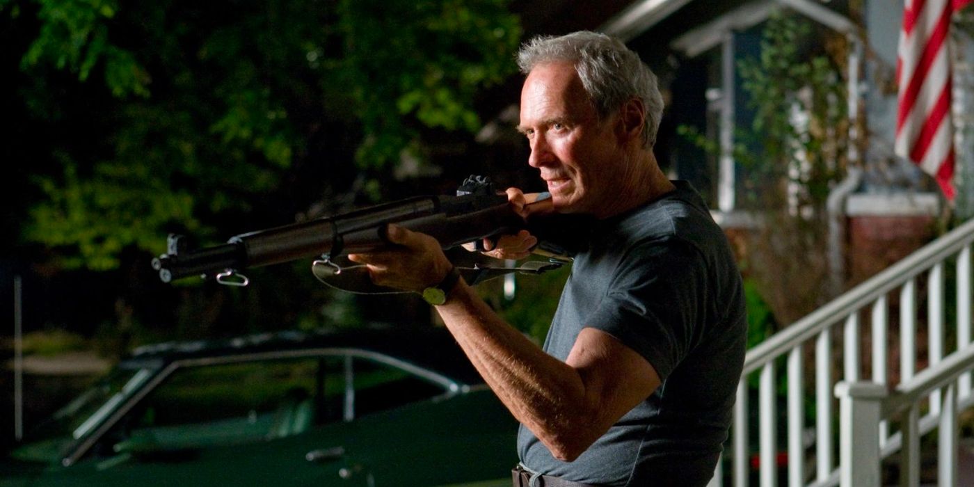 Walt Kowalski aiming his rifle at someone off-camera in Gran Torino