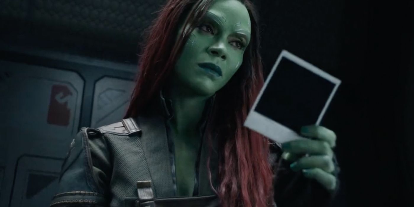 Gamora holding a photograph and looking pensive in Guardians of the Galaxy Vol. 3